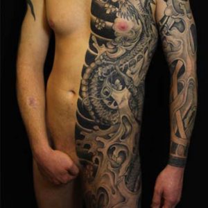 Black and skin half suit tattoo by S V Mitchell